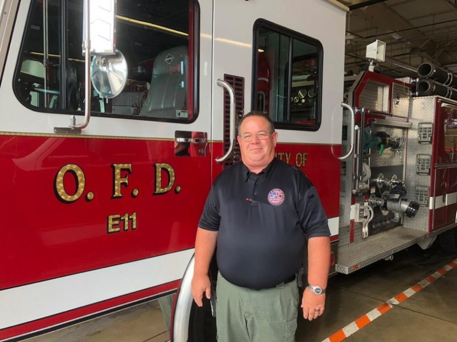 Oxford Fire Chief John Detherage, standing in front of one of the department’s trucks, said there is an upsurge of alcohol-related emergency calls at the beginning of every school year. <em>Photo by Emily Goliver</em><br>
