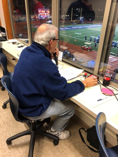 Joe Pyfrin calls a game during his 43rd season as the announcer for the Talawanda High School football team. Photo by Halie Barger