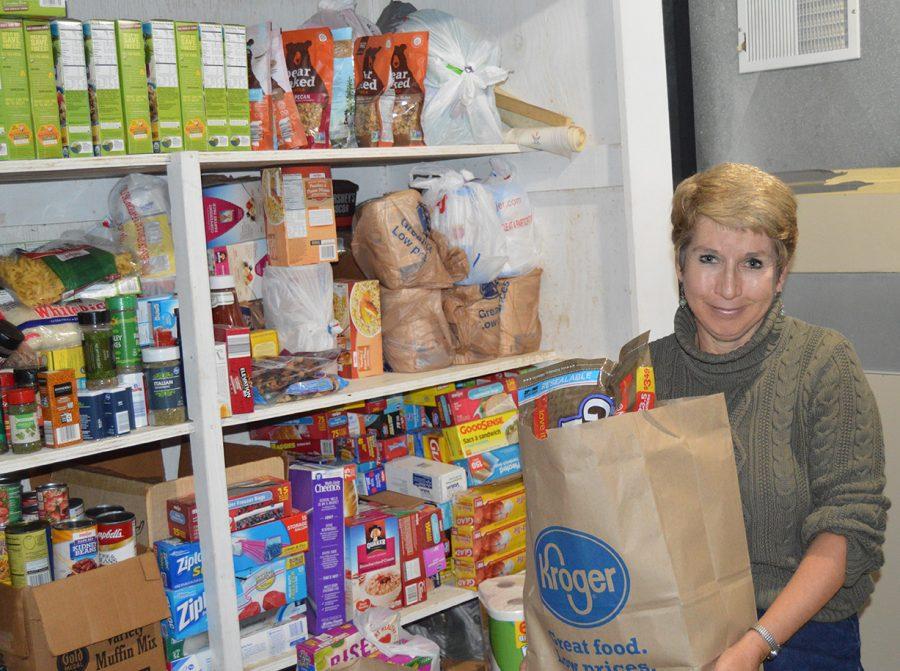 Susan Hurst stocks the basement shelves in her Oxford home with groceries purchased with her canny couponing. Every six weeks or so she fills up her car with what she has accumulated and donates it to the Oxford Community Choice Pantry. Photo by Rachel Berry