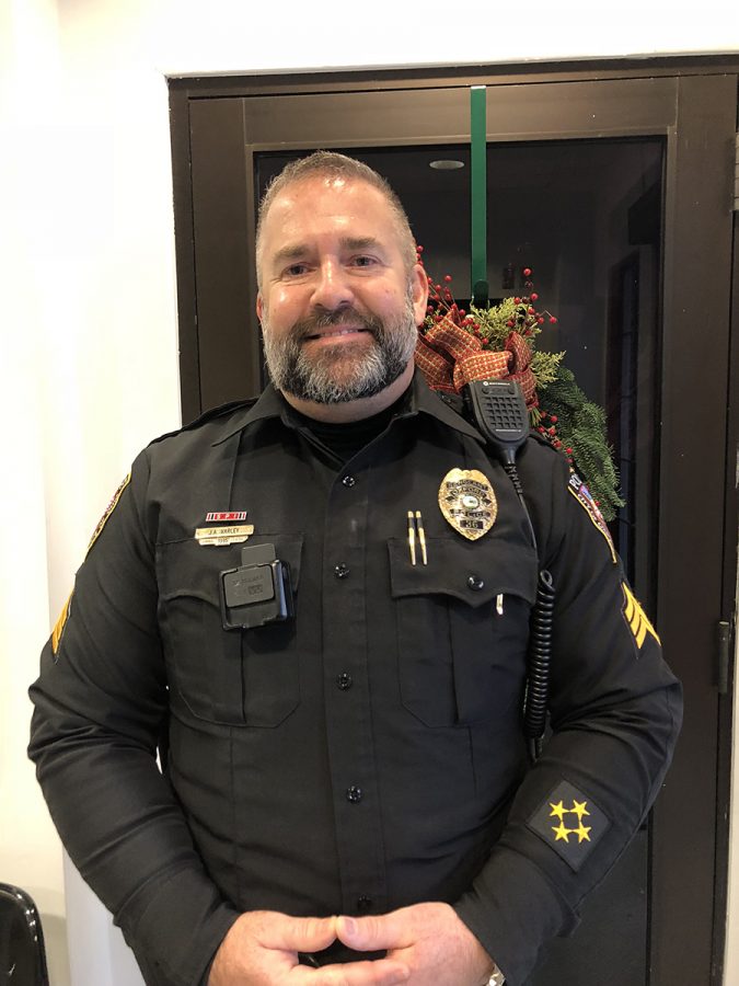 Oxford Police Sgt. Jon Varley, with his beard as of Dec. 5, is one of 21 city officers growing a beard in November and December to promote public interaction with police and to help raise money for Team Quintin. Photo by Peyton Gigante