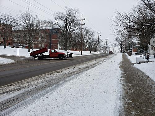 Snow overnight on Thursday caused a two-hour delay for the start of classes at Miami on Friday while salt trucks such as this one on Spring Street treated the roads. Photo by Ben Corwin