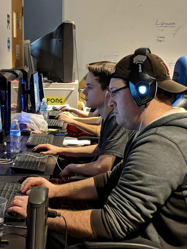 Cameron Foister and Luke Cunningham are in the zone finishing coding their game Gargoyle Condo with just 15 hours left. Photo by Rebecca Huff