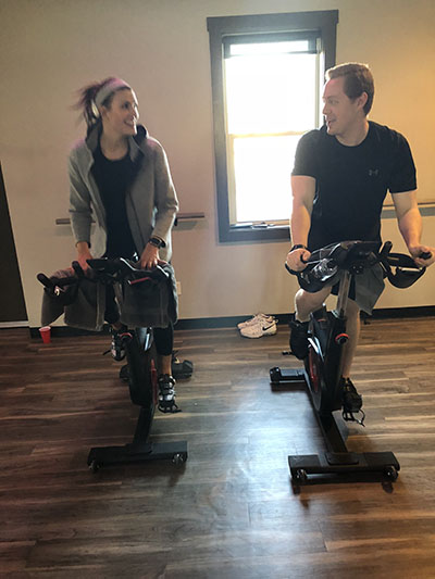  Jeffrey Plotka and Gaby Meissner work out on stationary bikes at Royal 24. Photo by Patrick Donovan