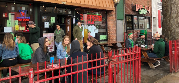 Skipper’s Bar and Pub is full of Green Beer Day celebrants Thursday about 3:30 p.m., enjoying “green beer towers” (far right) in honor of the town celebration. Photo by Leanne Stahulak