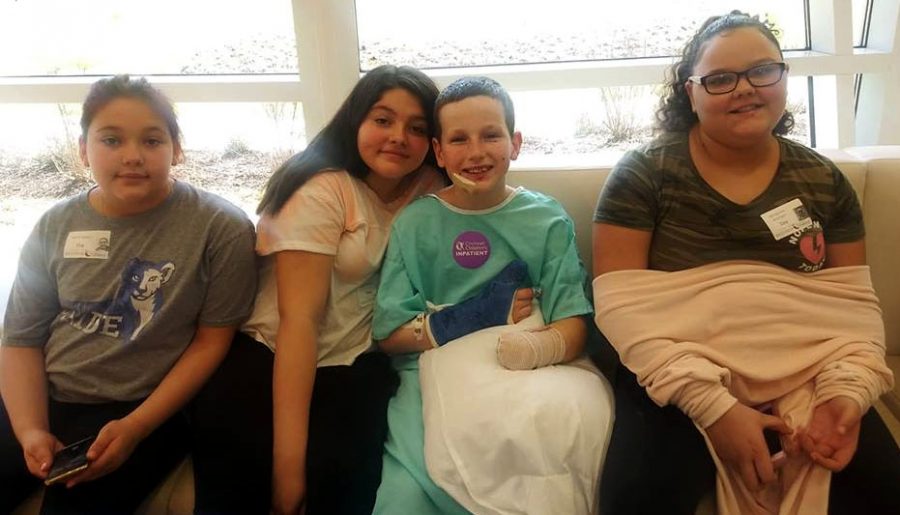 Caleb Bogan with members of his family, (left to right) sister Kaylin Bogan, cousin Ciarra, Caleb, and his cousin Adreyonna, shortly before going home from the hospital. Photo provided by the family