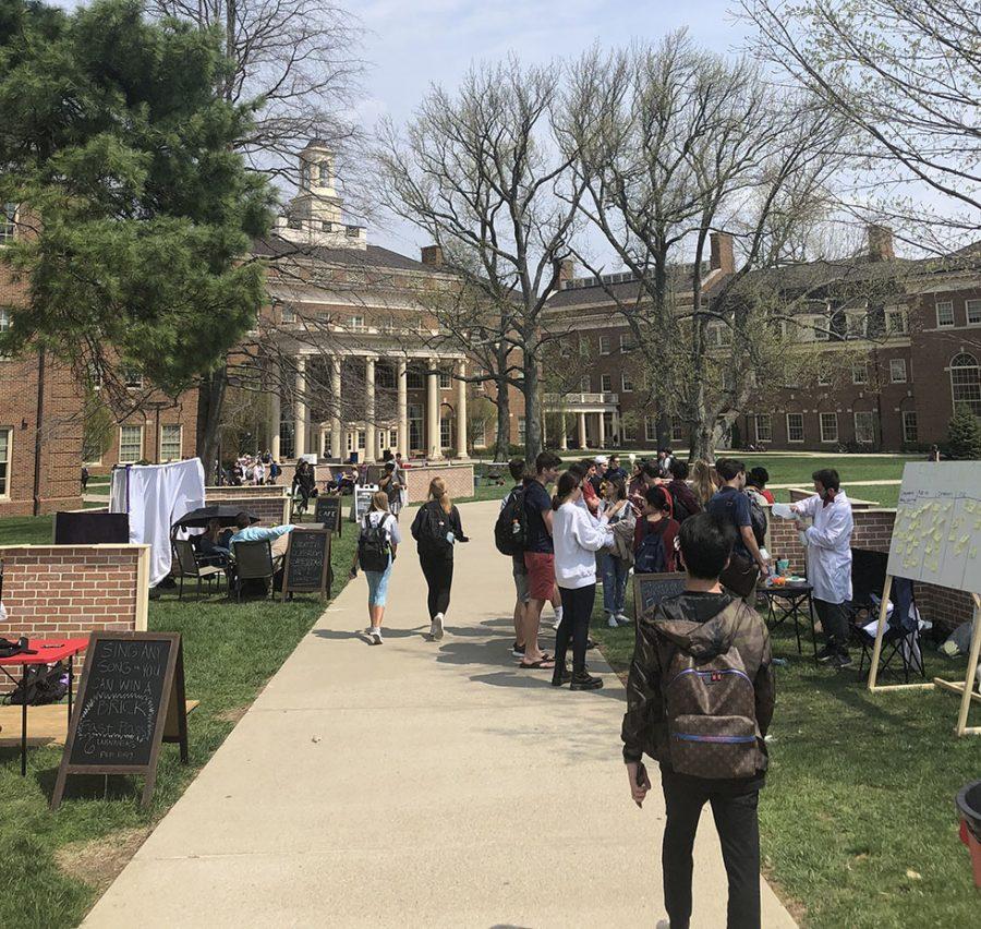 Students and visitors wander through the plots of the Creativity City on the lawn of the Farmer School of Business during the week of April 14-19. Photo by Patrick Donovan.