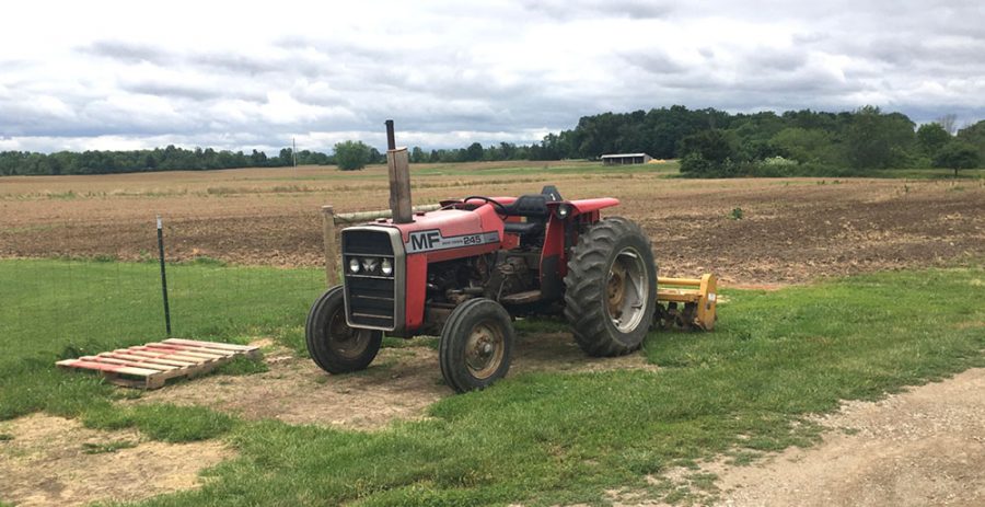 Until the fields dry out, Michael Schwab’s tractor will continue to sit idle at his Oxford farm. Photo by Aaron Smith