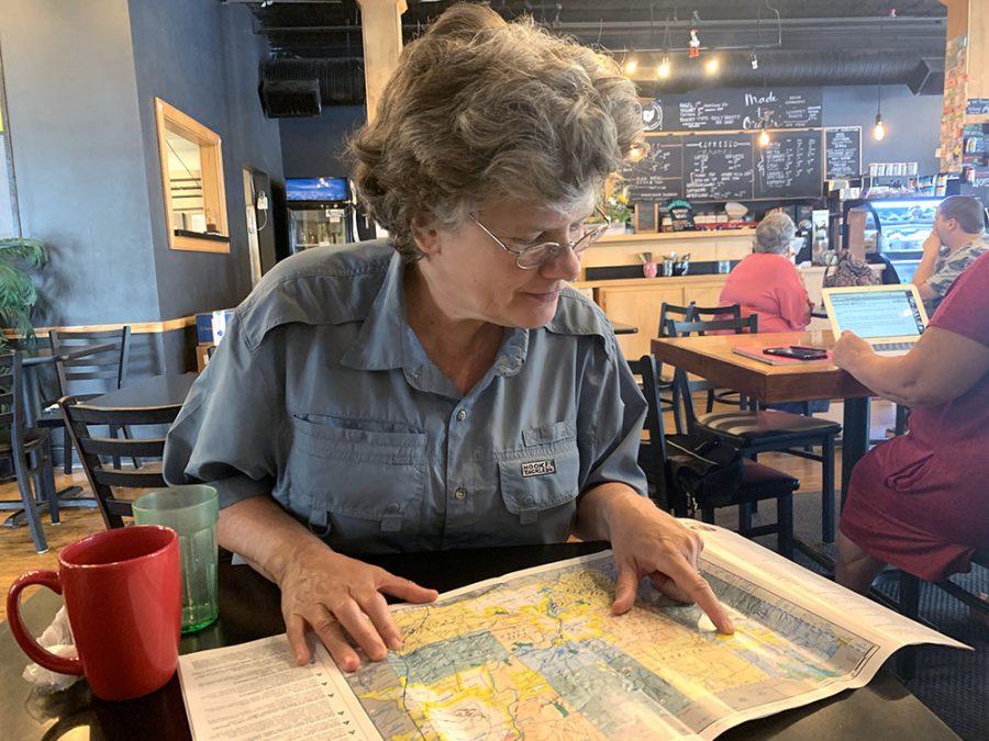 Mayor Kate Rousmaniere goes over a map of Butler County, during a recent interview in the Kofeyna coffee shop on High Street. Photo by Ryan McSheffrey