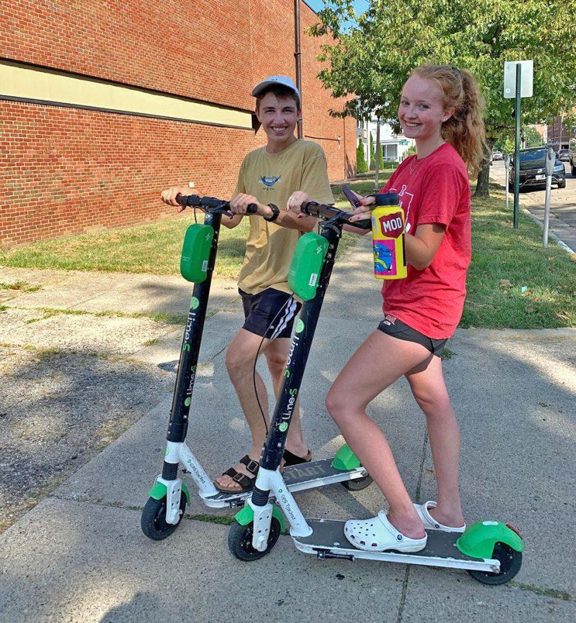Miami students Sam Ross and Corbett Haase go out for a ride Uptown on e-scooters. Photo by Abby Jeffrey. 