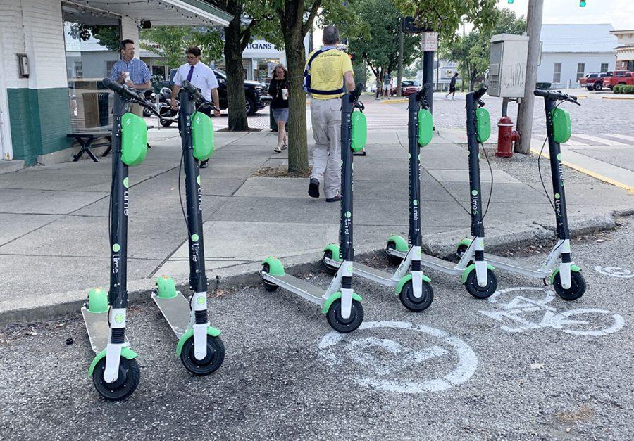 E-scooters have become a common sight around Uptown Oxford, such as in this designated parking spot just off High Street. Photo by Abby Jeffrey
