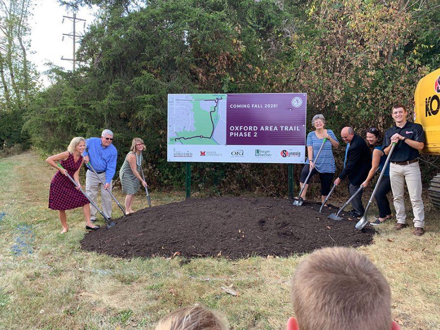 Left to right at the Tuesday groundbreaking for Phase II of the Oxford Area Trails System: Etta Reed, of Bayer Becker; Doug Elliott, Oxford city manager; Summer Jones of OKI; Oxford Mayor Kate Rousmaniere; Ted Pickerill, executive assistant to Miami President Gregory Crawford; Jessica Greene, assistant city manager; and Tanner Cook of Sunesis Construction. Photo by Abby Jeffrey.