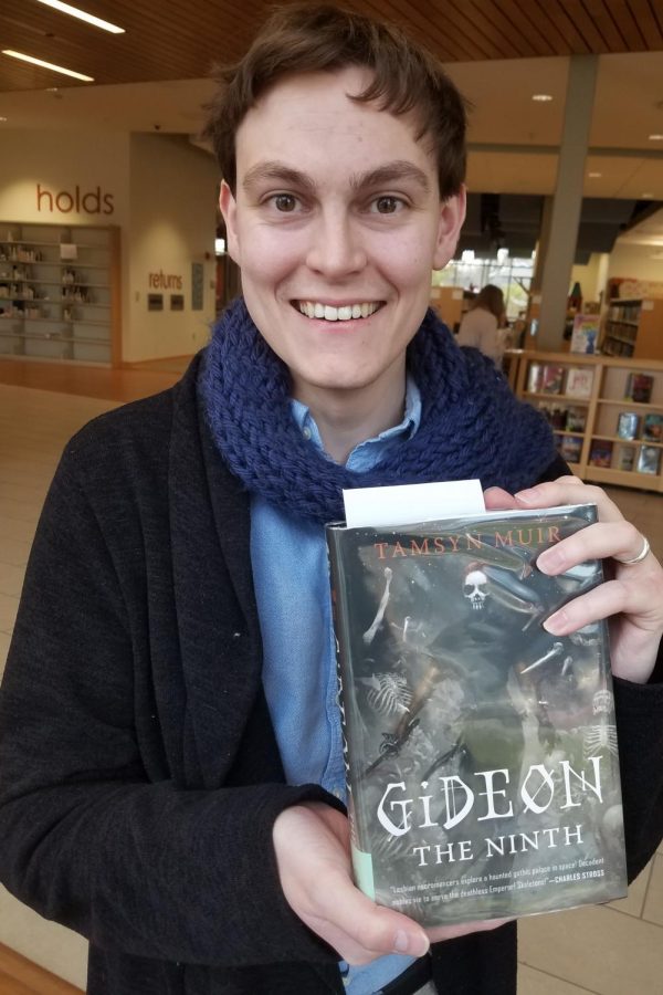 Reviewer David Halliwell holds a copy of “Gideon the Ninth,” available at the Oxford’s Lane Library. Photo provided by Lane Library.