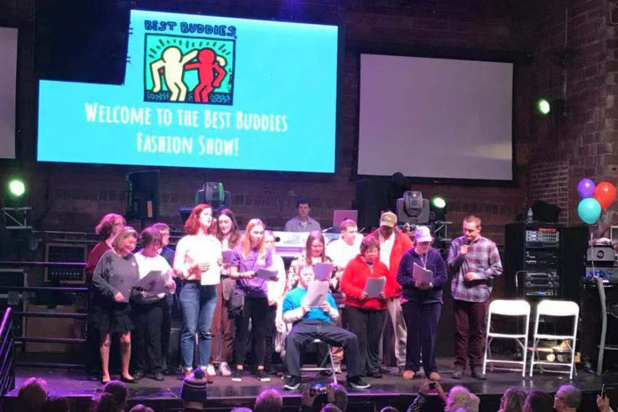 Members of Miami’s chapter of Best Buddies perform a song for the audience at the end of Sunday’s fashion show and karaoke at the Brick Street Bar on Sunday. <em>Photo by Yumeng Shen.</em><br>