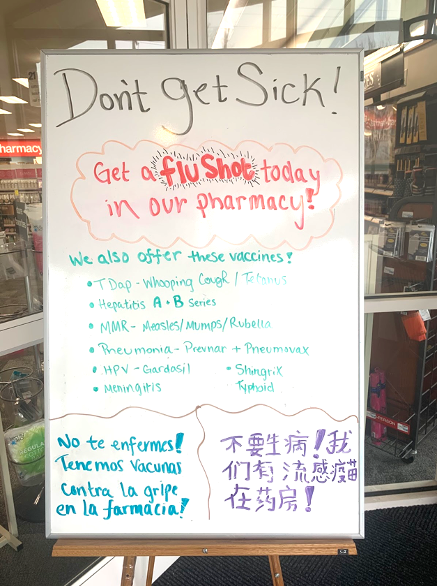 The CVS on W. Spring Street reminds customers in English, Spanish and Mandarin that it is not too late to get a flu shot. <em>Photo by Mallory Hackett</em>