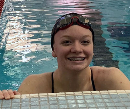 Makos swimmer Lucie Morris takes a breather during her Monday practice at the Miami Recreation Center. Photo by Brady Pfister