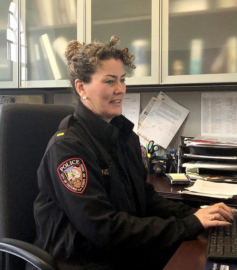  Lt. Lara Fening of the Oxford Police Department types out the “Weekend Update,” an account of police activity every Monday. Photo provided by Emma Kinghorn.