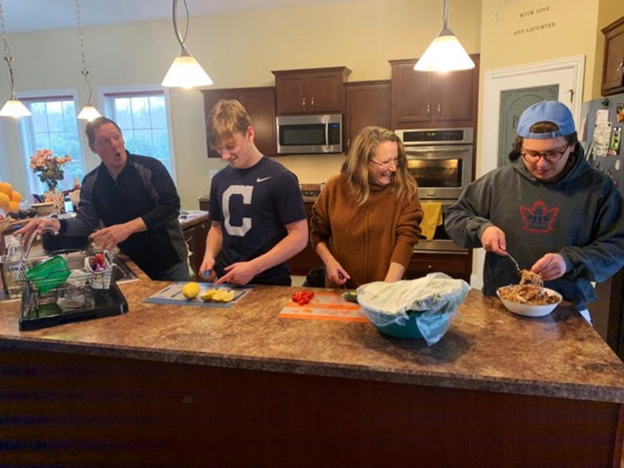 The Grosels (left to right) Dean, Justin, Mary and Zach, with Julia behind the camera, have a new family hobby – crowding in the kitchen -- thanks to Ohio’s stay-at-home orders. Photo by Julia Grosel