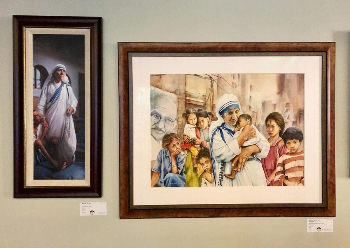 These paintings of Mother Teresa in the distinctive blue-bordered white habit of the Missionaries of Charity, are part of the display at the Interfaith Center. Photo by Marla Chavez Garcia