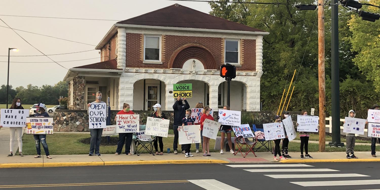 Demonstrators gather outside Talawanda offices on W. Chestnut St.