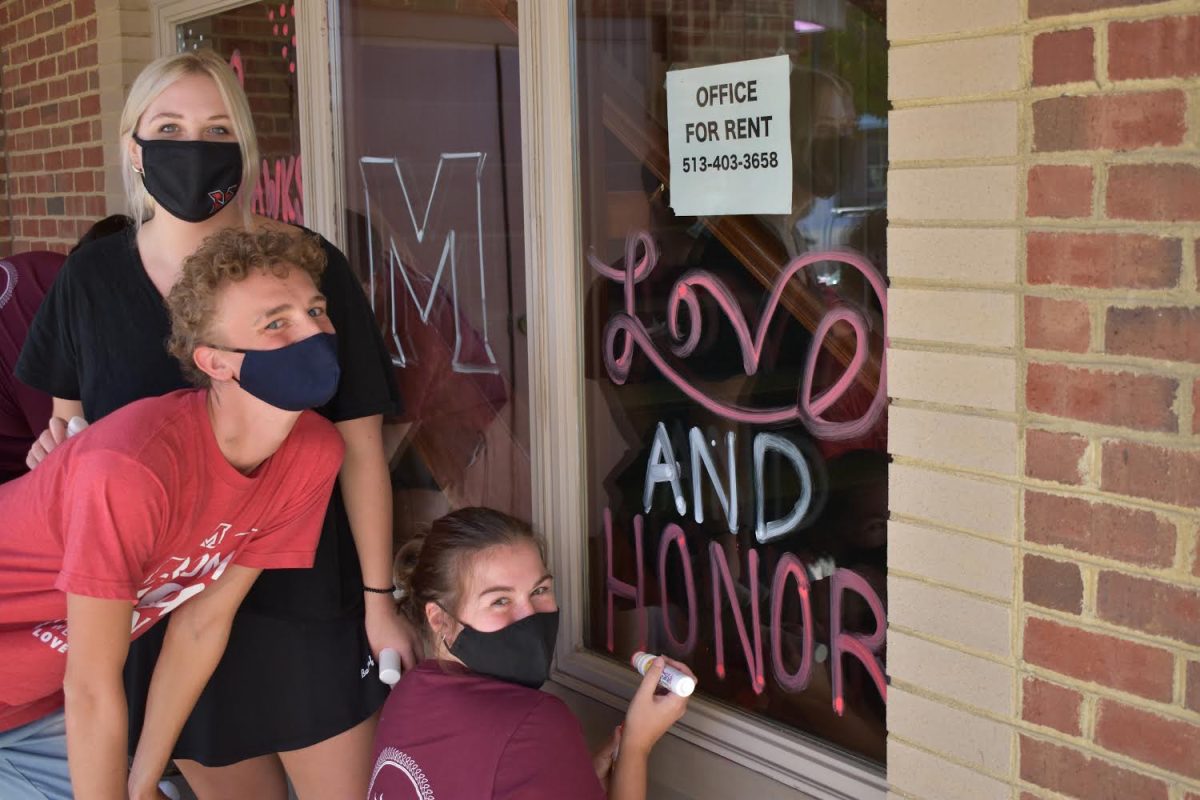 Volunteers decorate Oxford with Miami spirit for virtual homecoming begining Oct. 9