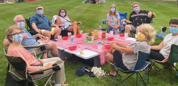 Oxford residents enjoy drinks and dining on the grass of Uptown Park