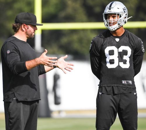 Frank Smith, (left), the newly appointed run game coordinator for the L.A. Chargers, helping coach tight end Darren Waller (#83) last year.