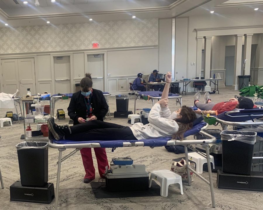 Donors stretch out on cots and give blood in Miami University’s Shriver Center.