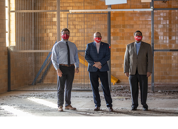 From left, Seth Cropenbaker, assistant to the Oxford city manager; Miami President Gregory Crawford and Randi Thomas, head of the university’s ASPIRE office, check out the now-vacant building that will house the innovation hub at 20 S. Elm St.