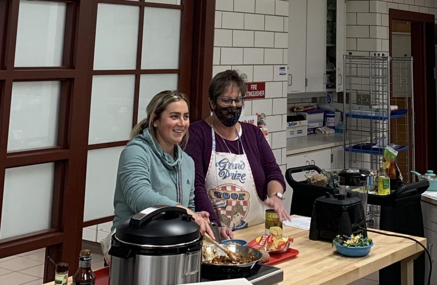 Nancy Parkinson (right) and Emily Kahn, junior dietetics and nutrition major and member of SAND, cook jackfruit BBQ while chatting with participants on Zoom.