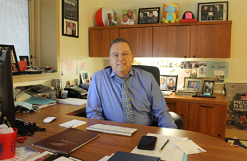 school principal at desk