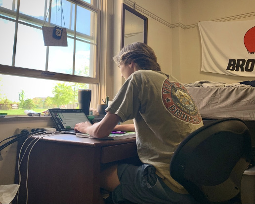 Aidan Blakley working at his desk in Havighurst Hall, located on Western Campus, before finals earlier this month.