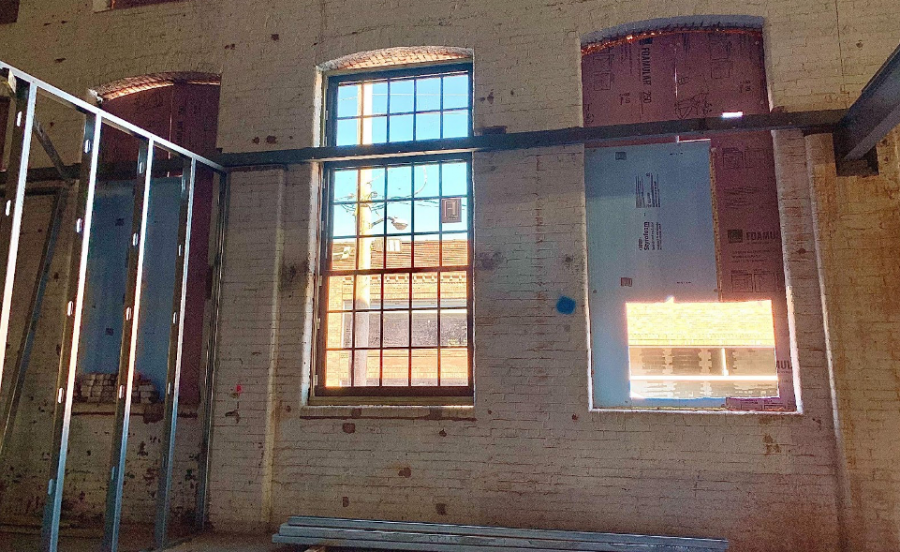 The first window installed in the ballroom sheds light into the construction site. 