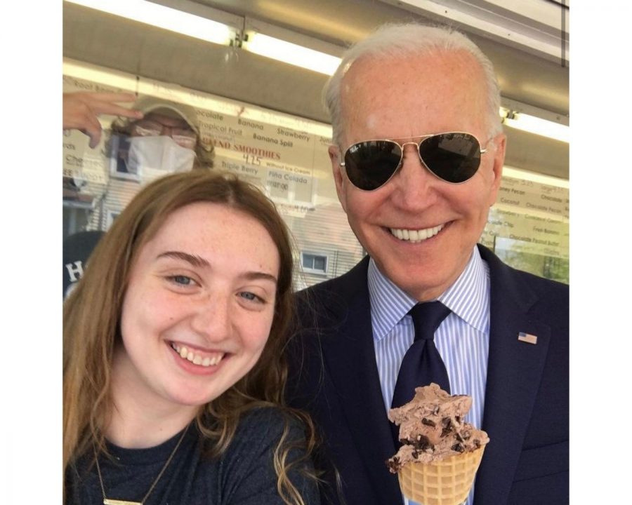 Miami Junior Grace Kelley poses with President Joe Biden, who she served some chocolate chocolate chip ice cream. The president stopped by the Honey Hut ice cream shop where she works, in Cleveland last week.