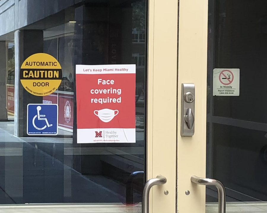 Stickers showing that masks are required, such as this one on a door to Shriver Center, will remind returning students that masks are required to be worn inside all Miami University buildings this fall.