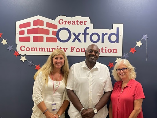 Melford Edwards stands between Holli Morrish, communications director for Talawanda School District (left), and Betsy Hope executive director of the Greater Oxford Community Foundation, during a recent celebration announcing the Melford Edwards Scholarship.