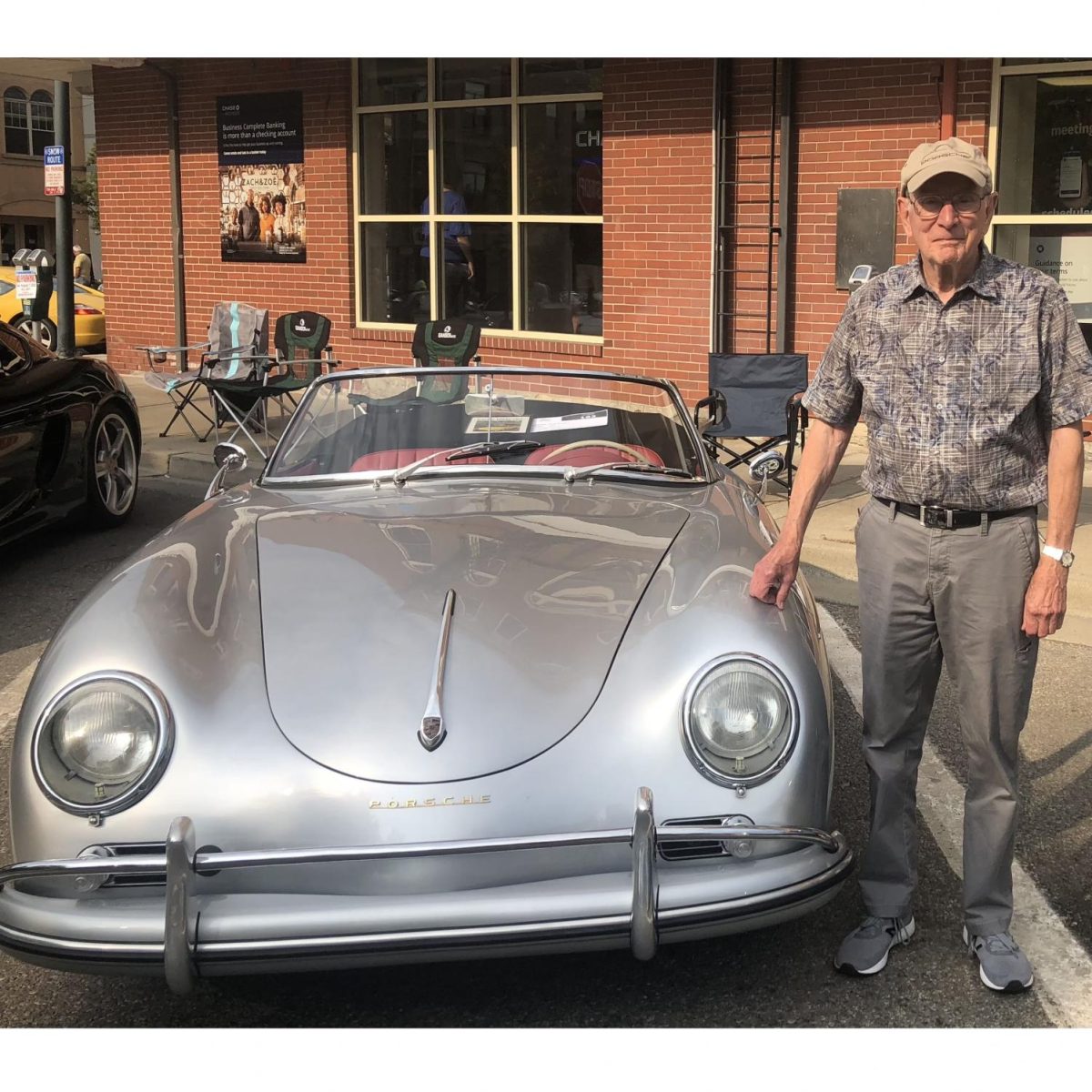 Dick Snyder with his silver 1959 Porsche.