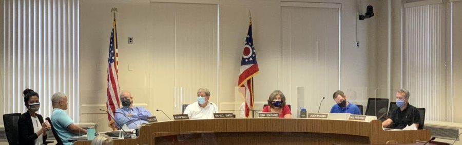 Council votes 6-1 at a special meeting Monday to require masks be worn inside all public spaces in the city. Councilor Glenn Ellerbe, second from left, was the only member of council unmasked during the meeting and the only member to vote against the ordinance. 