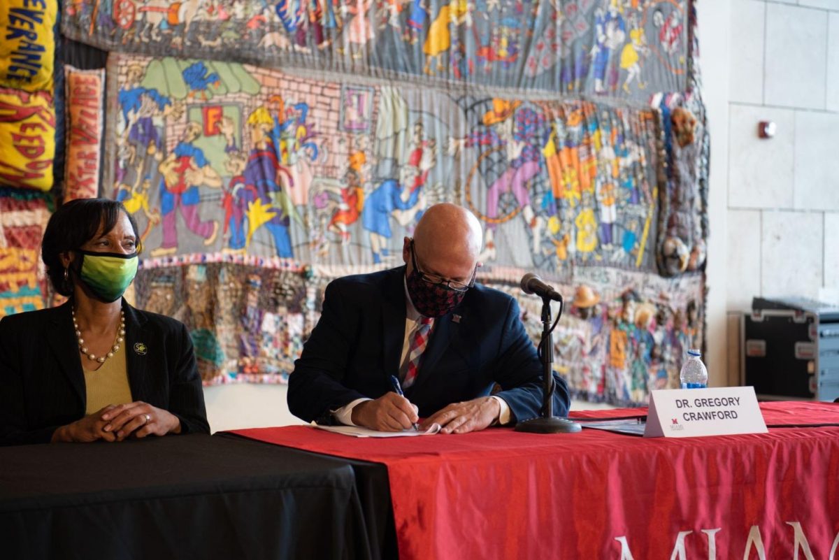 Miami President Gregory Crawford pledges Miami University’s support to the Moon Shot for Equity initiative Wednesday in a ceremony with other college presidents at the Underground Railroad Freedom Center in Cincinnati.