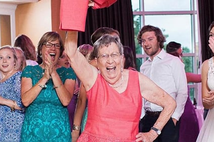 Winifred Pearson, seen here at her granddaughter’s wedding in 2016, was known for an exuberant personality and was described by the university as one of Miami’s most avid sports fans. 