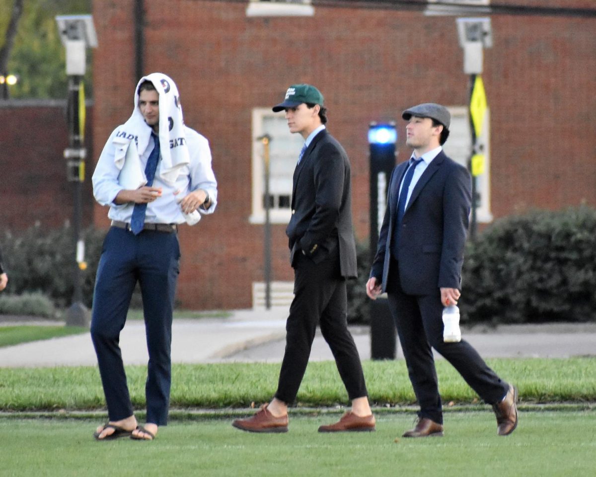 Left to right: Coaches Dominic Giovanetti, Nate Aliapoulios, Alec Stacy on the sideline of a women’s club soccer game. The coaches all are members of Kappa Alpha Order fraternity.