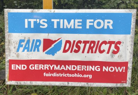 Fair District signs, urging non-partisan election maps, such as this one on the corner of Chestnut and Oxford-Reily Roads, can be found on lawns and roadsides  throughout the area.