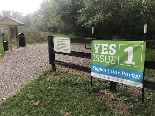 A sign of support for passage of the Butler County MetroParks replacement levy at the entry at Four Mile Creek Park in Oxford. The levy appears as “Issue I” on the Nov. 2 ballot in Butler County. 