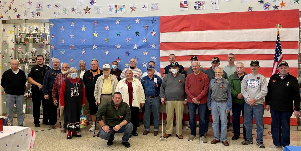 The 24 veterans who attended the breakfast are honored in front of a flag put together by FCCLA. The stars were made by elementary students throughout the district.