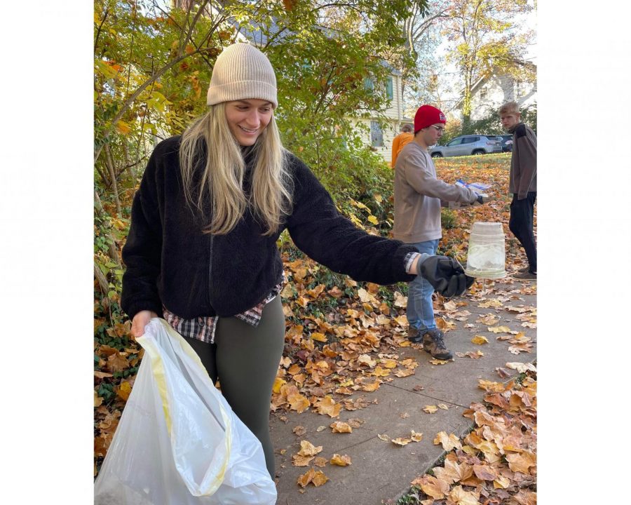 Sara Grieco picks up trash on East Church Street in Oxford. Thousands of pieces of trash are discarded on the streets of Oxford – paper, plastic and the ubiquitous aluminum can.