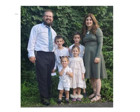 Yossi Greenberg, his wife Mushka and four children getting ready for a recent Friday night dinner. 