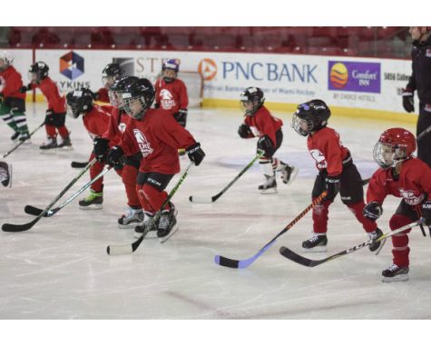 The Miami Jr. RedHawks, a local youth hockey team playing in this weekend’s Big Bear Hockey Tournament in Oxford, practicing on the ice at Goggin Ice Center. 