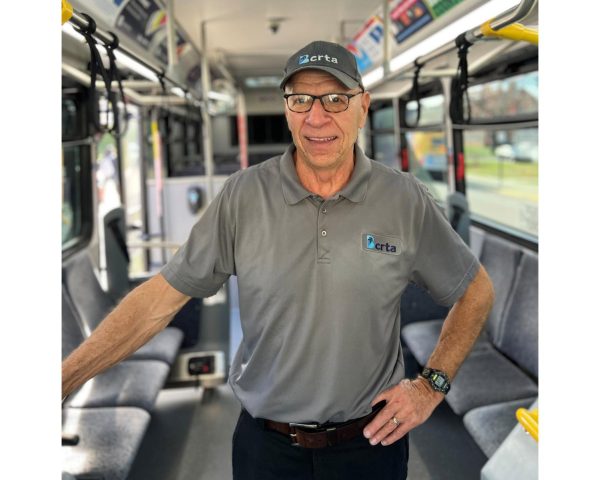 Tim Fritzsche has a smile for those who board his bus. 