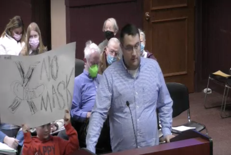 Oxford resident Chris Williams, pictured with his son, urged city council to enact an emergency removal of the mask mandate at city council Feb. 15. 
