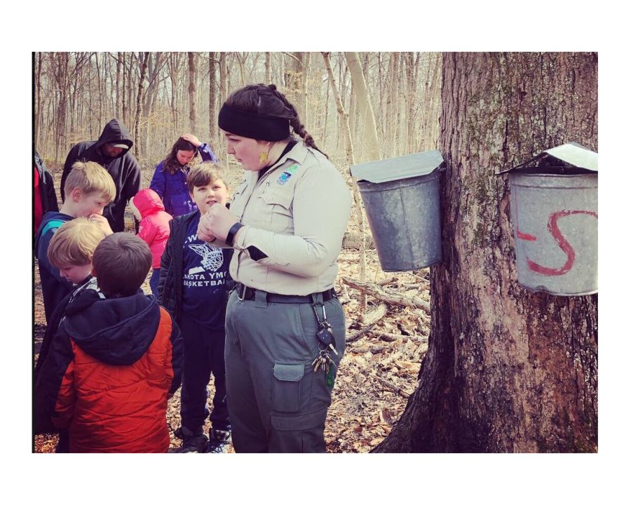 Hueston Woods staff members demonstrate how to tap maple trees and make syrup. 