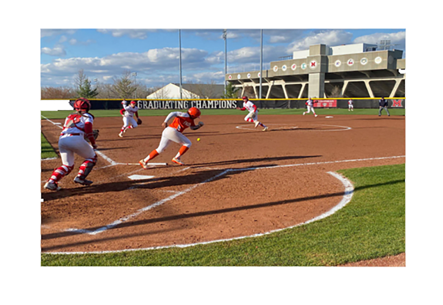 Miami pitcher Courtney Vierstra chases a bunt hit by Bowling Green.
